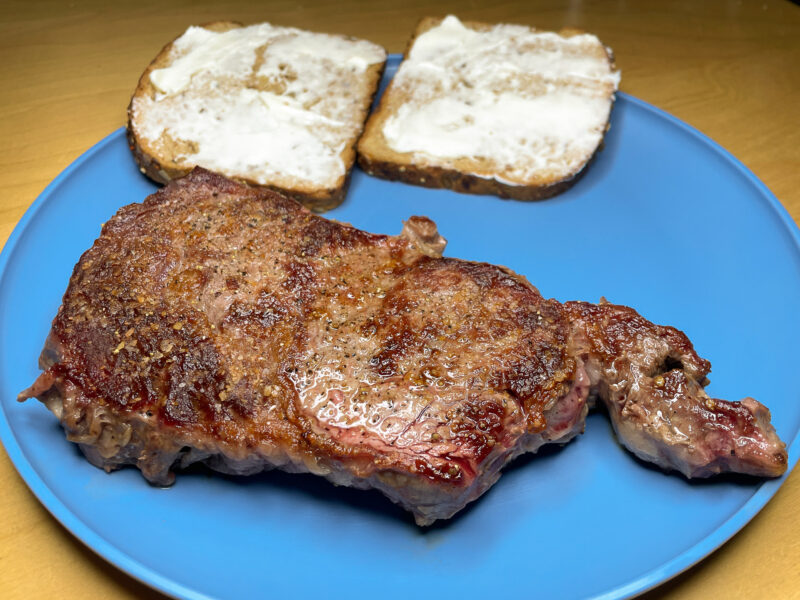 Rib Eye on a Blue Plate