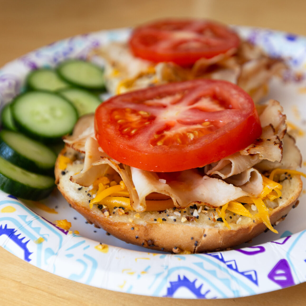 tomato and sliced turkey on a bagel