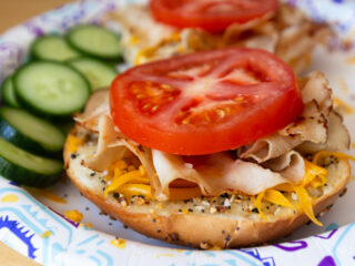 tomato and sliced turkey on a bagel