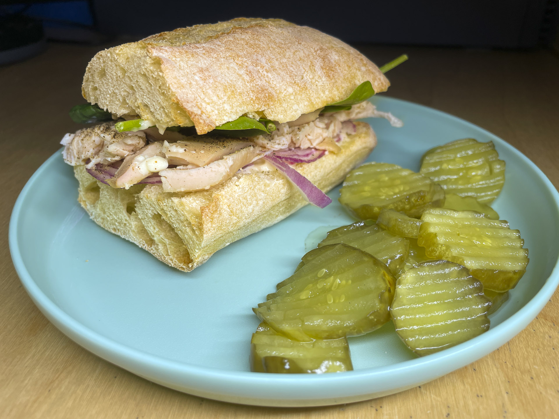Roast Chicken with Spinach and Red Onion on a Ciabatta Baguette