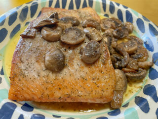Buttered Mushrooms with Garlic Over Salmon