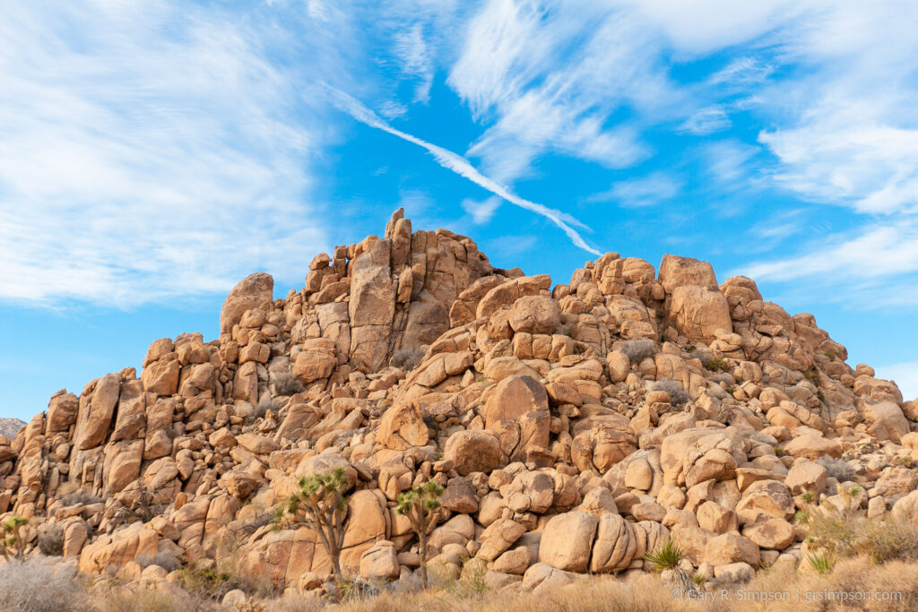 Blue Sky, Contrails, and Boulders