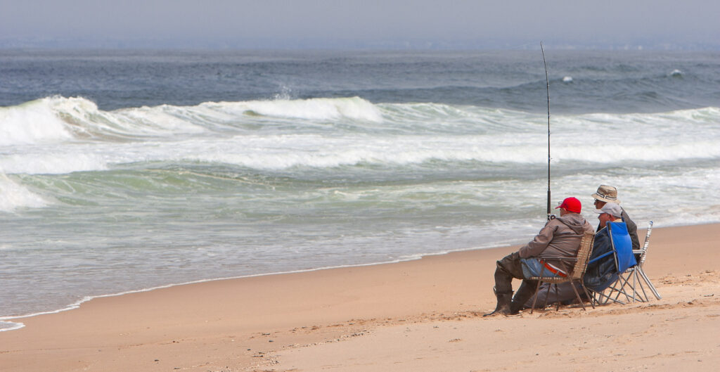 Three men surf fishing at Guadalupe Dunes