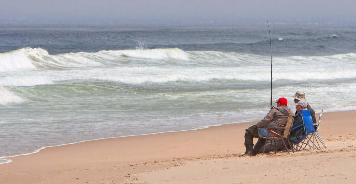 Three men surf fishing at Guadalupe Dunes