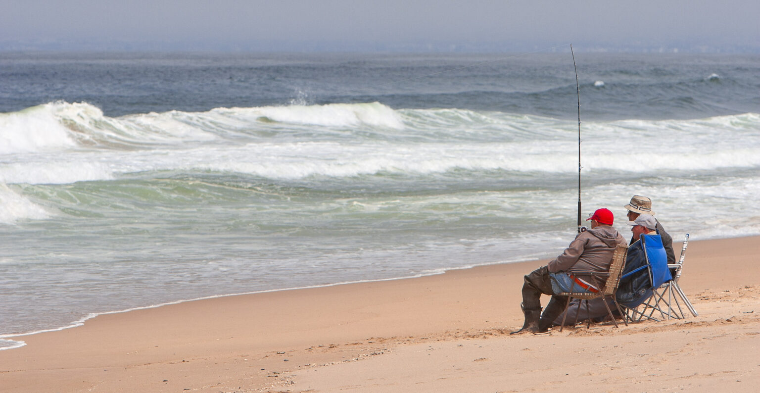 Three men surf fishing at Guadalupe Dunes