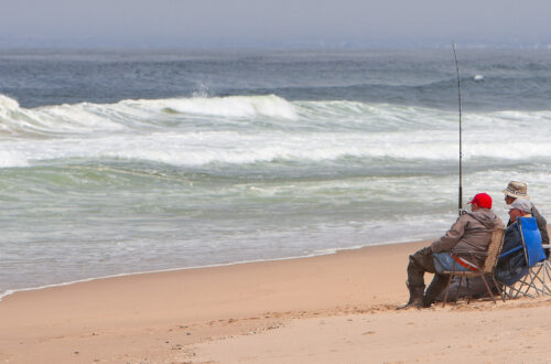 Three men surf fishing at Guadalupe Dunes