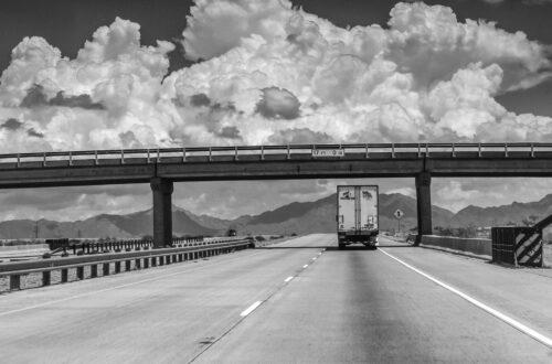 Semi-Truck Under Overpass